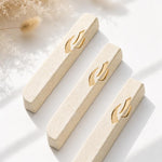 Handcrafted Jerusalem stone mezuzah in cream color with gold accents, suitable for indoor and outdoor doorways, includes mounting tape.