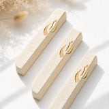Handcrafted Jerusalem stone mezuzah in cream color with gold accents, suitable for indoor and outdoor doorways, includes mounting tape.