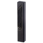 Angled view of the Modern Embossed Gold Shin Black Concrete Mezuzah, a matte black waterproof mezuzah case from Israel with a tall raised Shin outlined in gold, sized for a 5-inch kosher scroll