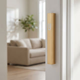 Modern gold aluminum outdoor mezuzah mounted on a doorframe, showcasing a sleek and durable design for exterior use.