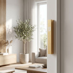 Hyper-realistic scene of a modern gold aluminum outdoor mezuzah mounted on an interior doorway's right side, showcasing its simple, timeless design and waterproof features.