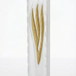 High-resolution image of a modern gold Shin in a frosted glass mezuzah case, shown on a clean white background with subtle reflection.