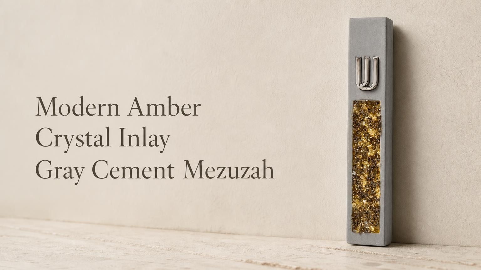 Modern gray cement mezuzah displayed upright in a minimalist setting with a raised silver-tone Shin and vertical golden amber crystal and glass inlay, highlighting warm honey, bronze, and gold reflections against the cool neutral cement surface