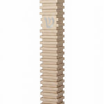 Modern Golden Steps champagne aluminum mezuzah case on a white background with layered horizontal bands and a centered silver Hebrew Shin