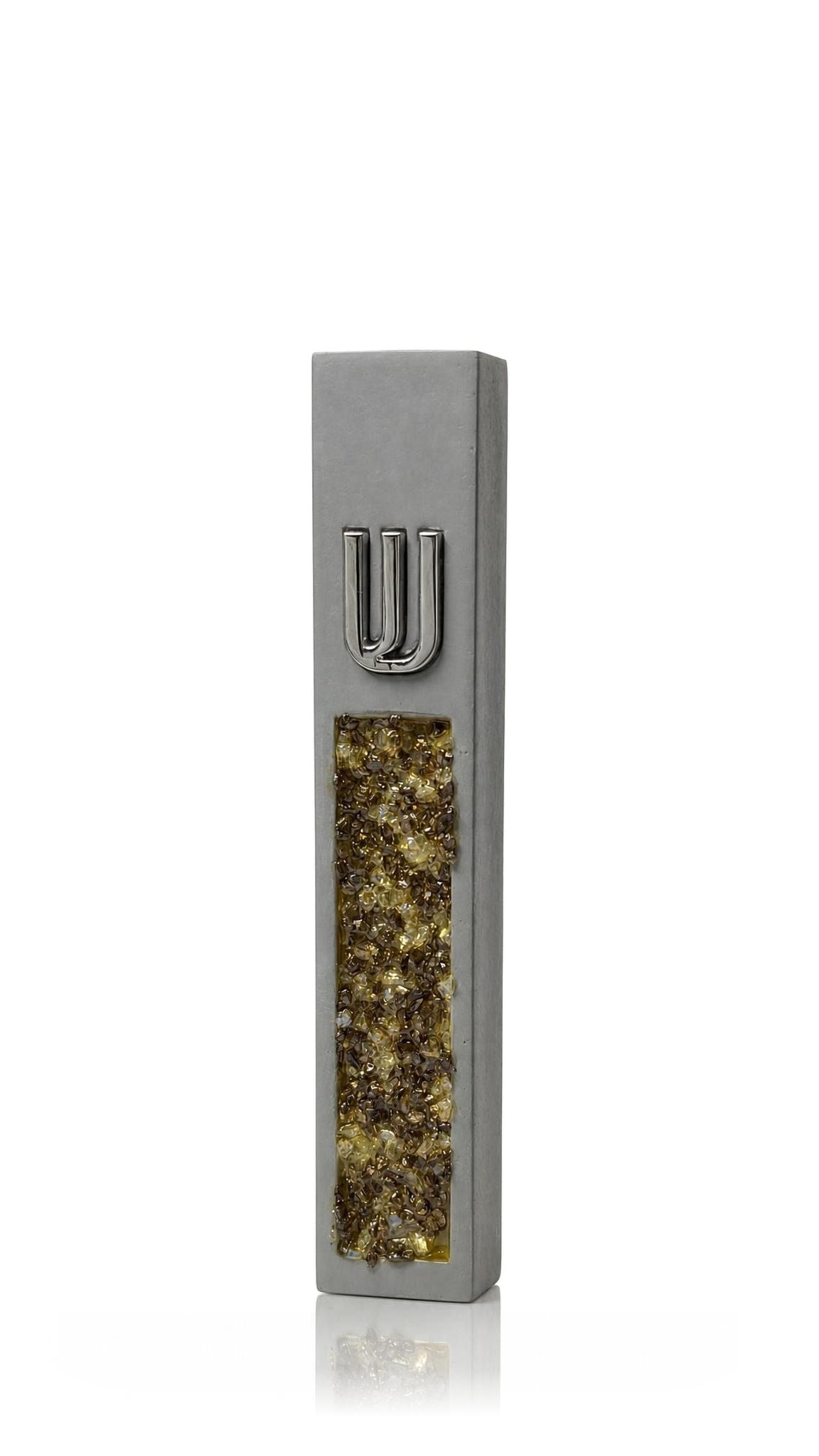 Contemporary gray cement mezuzah cover with warm amber, honey and golden crystal and glass inlay below a raised silver Hebrew Shin, pairing natural stone-like texture with reflective detail for artistic Jewish home decor