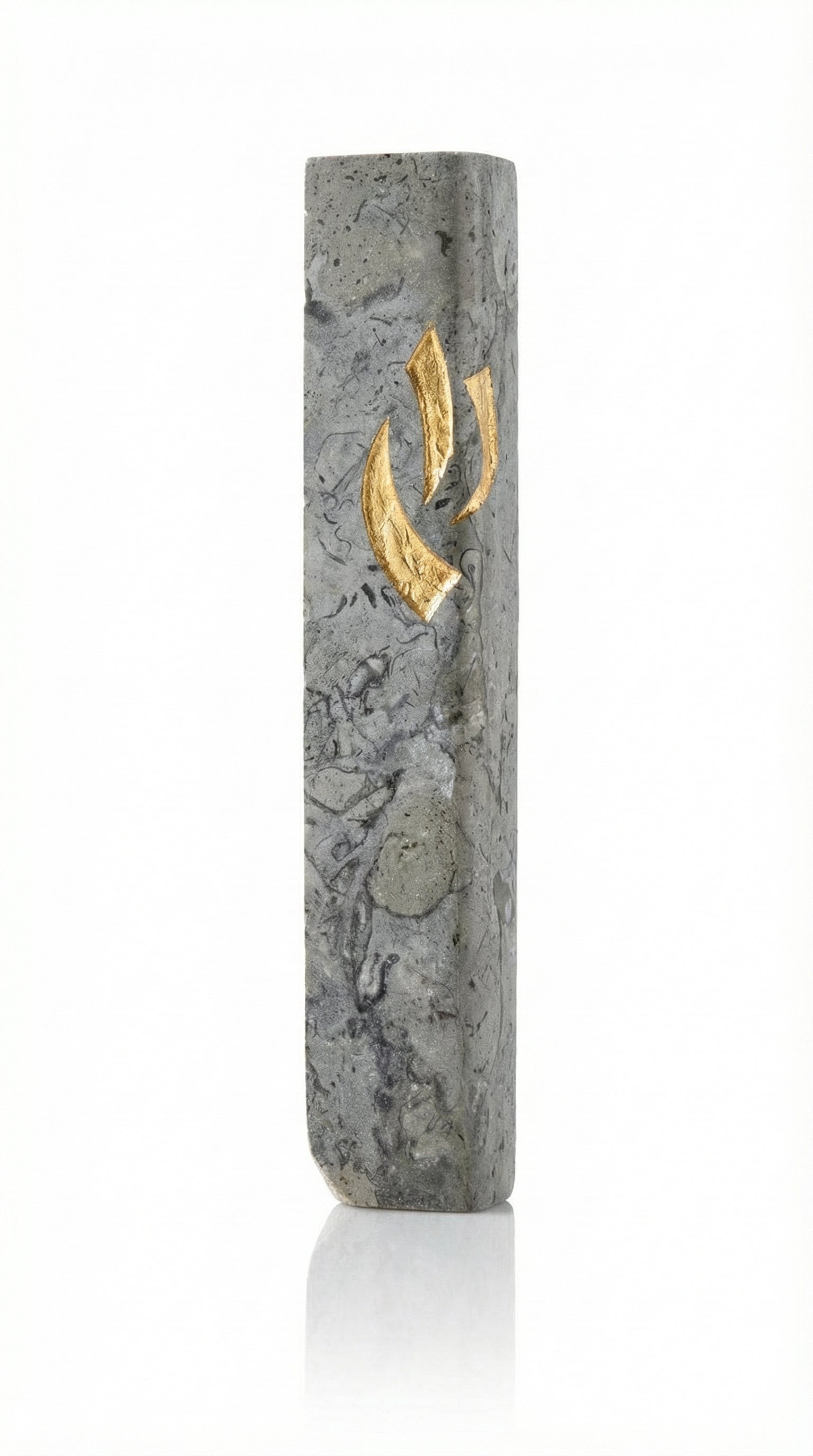 Detailed view of a handcrafted Jerusalem stone Mezuzah in gray, with intricate Hebrew engravings, on a clean white studio background with soft reflection.