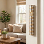 Modern Grooved Cylinder Champagne Aluminum Mezuzah cover mounted on the right doorpost in a home