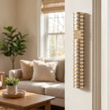 Modern Grooved Cylinder Champagne Aluminum Mezuzah cover mounted on the right doorpost in a home