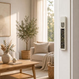 Modern Iridescent Crystal Inlay White Cement Mezuzah mounted vertically on a white residential doorpost, showing the raised silver-tone Shin and reflective multicolor crystal and glass inlay in a bright contemporary Jewish home interior
