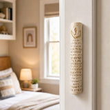 Jerusalem Stone Mezuzah case with gold Hebrew lettering, mounted on a residential doorpost in a lifestyle setting.