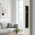 Hyper-realistic scene of a modern black aluminum mezuzah mounted inside an outdoor doorway on the right side, showcasing its sleek design and secure placement.