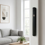 Hyper-realistic scene of a modern black aluminum mezuzah mounted inside an outdoor doorway on the right side, showcasing its sleek design and secure placement.