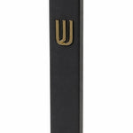 Modern Raised Gold Shin Black Cement Mezuzah, a six-inch Israeli-made case with a matte black body and polished gold Hebrew Shin
