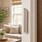 Indoor lifestyle shot of exact sandstone pyramid mezuzah mounted on a residential doorpost.