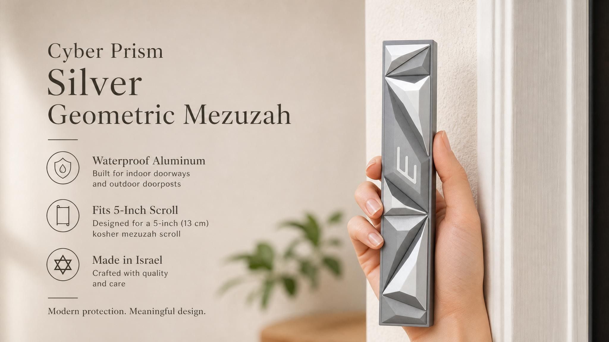 Person holding the Cyber Prism Silver Geometric Mezuzah, showcasing its sculpted angular silver panels and Hebrew Shin.