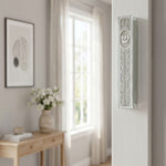 Silver Script Glass Mezuzah case mounted on a doorway, showcasing its modern, elegant design with silver details and clear glass body.