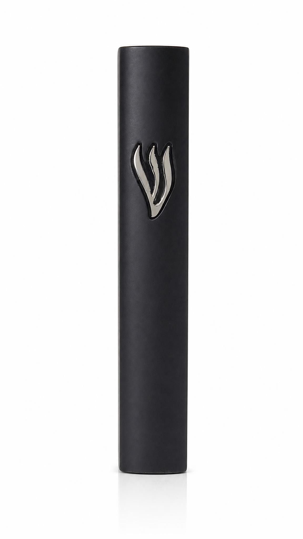 Matte black cement mezuzah case with a raised sculptural silver Shin centered near the upper front
