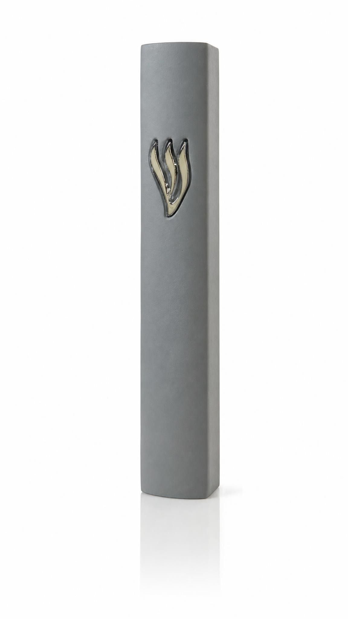 Smooth gray cement mezuzah case with a raised sculptural silver Shin on the upper front