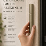 Person holding the modern waterproof champagne green aluminum outdoor mezuzah, showcasing its slim, contemporary design.