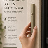 Person holding the modern waterproof champagne green aluminum outdoor mezuzah, showcasing its slim, contemporary design.