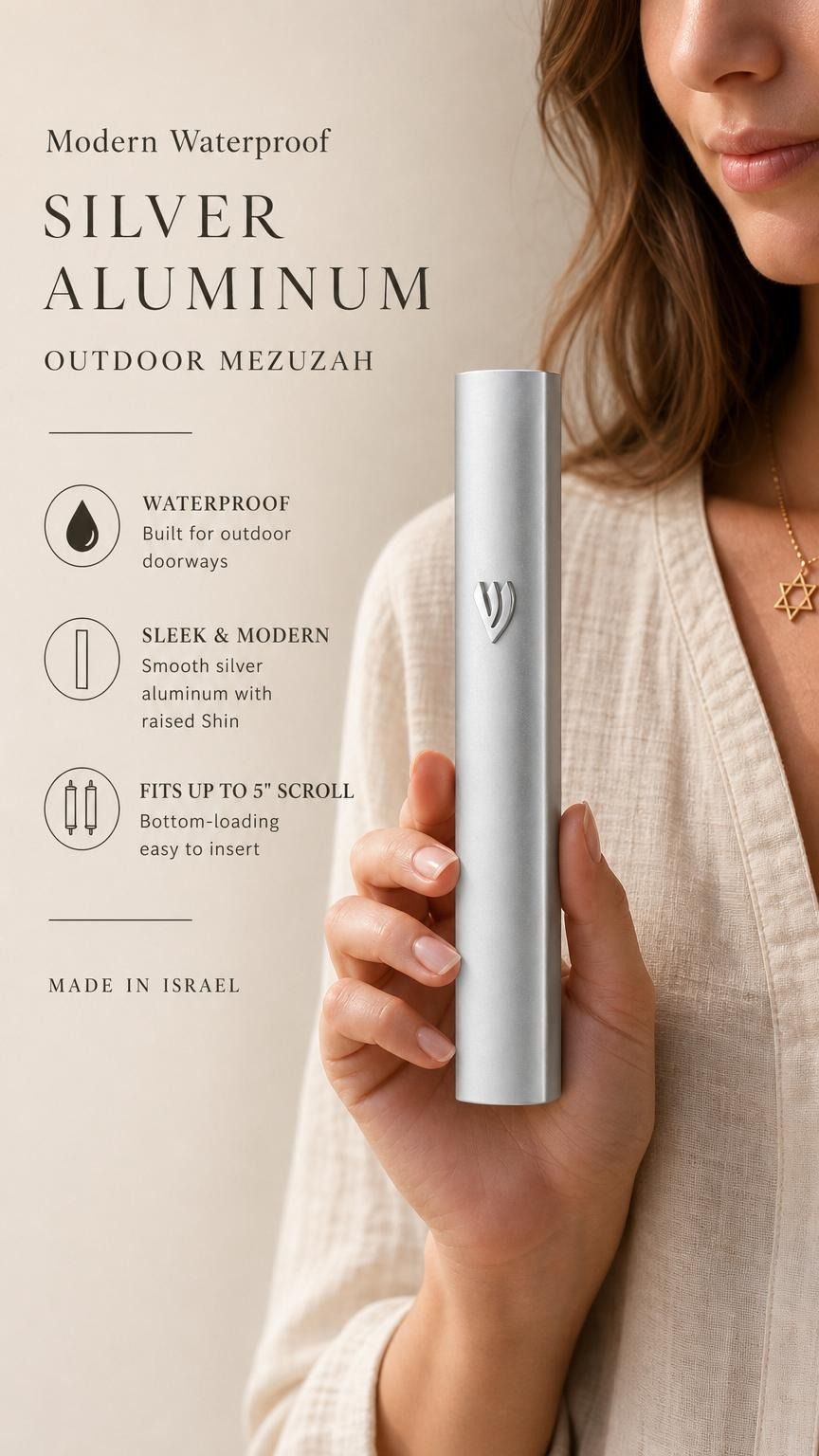 Premium handheld image of the modern waterproof silver aluminum mezuzah, held naturally with editorial text on the side, in soft neutral tones.