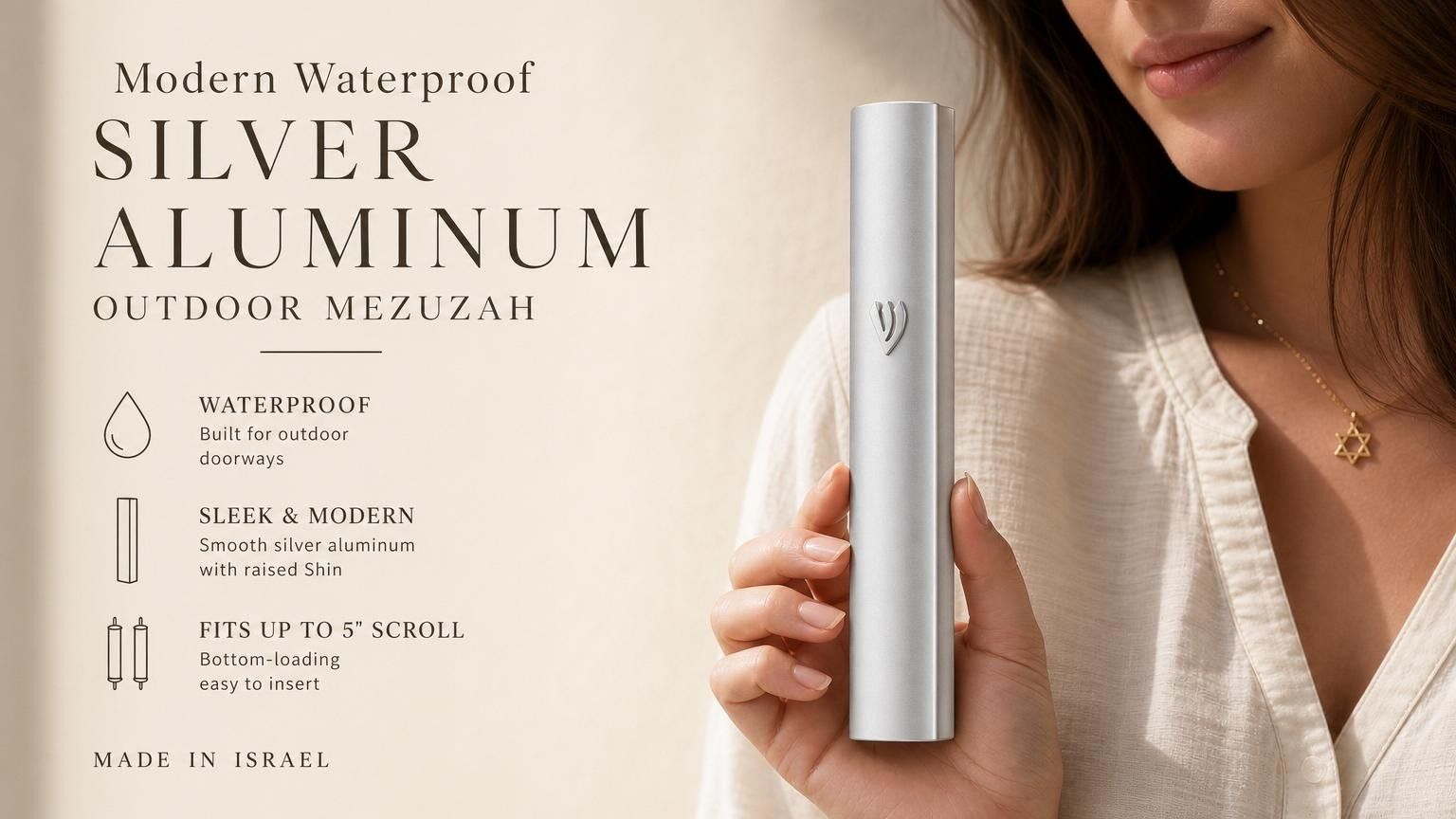 Hand holding a modern waterproof silver aluminum outdoor mezuzah with a sleek design and smooth silver finish