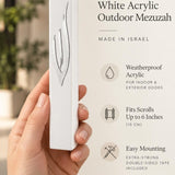 Close-up of the sculpted silver Shin with a polished finish on the smooth white acrylic face of the waterproof seven-inch Israeli mezuzah case for modern door frames