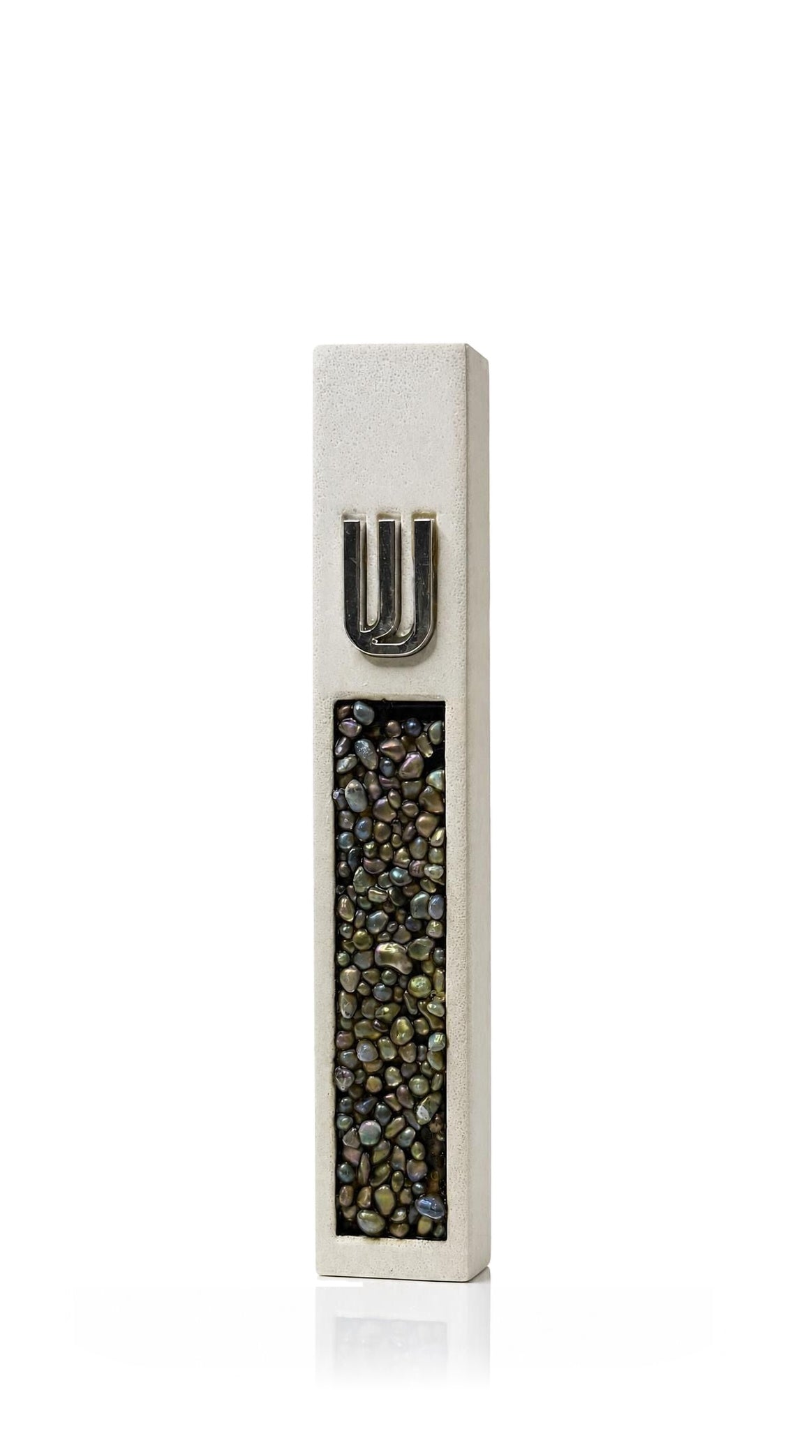 Modern white cement mezuzah cover with a raised silver Hebrew Shin and iridescent crystal and glass inlay reflecting charcoal, pearl, bronze and subtle green tones, bringing luminous mosaic detail to artistic Jewish doorway decor