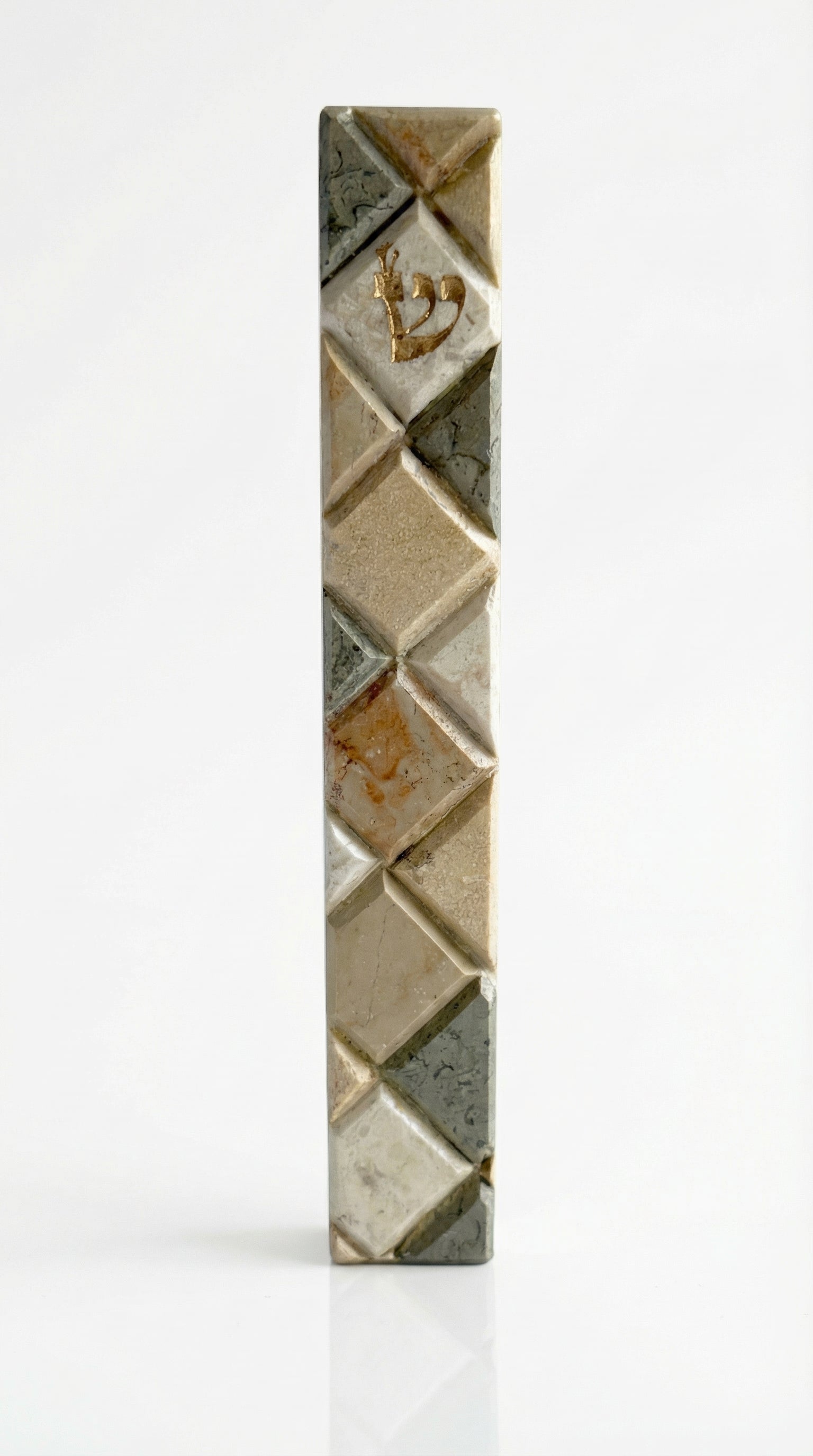 Large Jerusalem stone mosaic mezuzah with Hebrew engravings, decorative motifs, and reflection on white studio background.