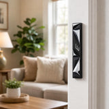 Realistic indoor shot of the mezuzah mounted correctly on a residential doorpost on the right side, showing orientation and placement.