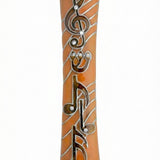 Orange pewter mezuzah with musical symbols, treble clef, decorated stones, suitable for home doors, glossy finish, handcrafted in USA.