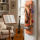Hyper-realistic image of a bold orange violin motif mezuzah mounted on a narrow doorway in a music-themed room, emphasizing craftsmanship and vibrant color.