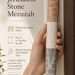 Person holding the Jerusalem stone mezuzah in a premium editorial style with warm natural light and balanced composition.