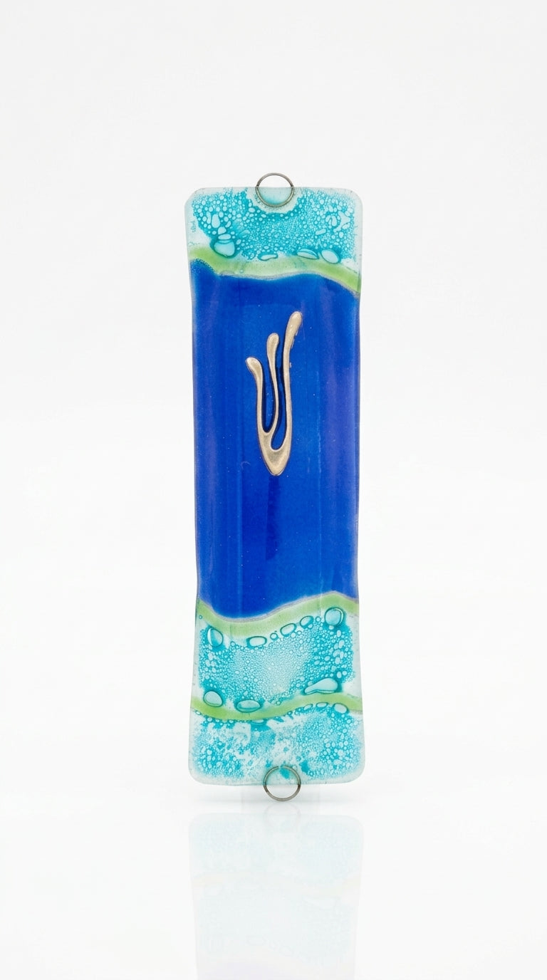 Elegant glass mezuzah with Hebrew inscriptions, displayed on a clean white studio background with soft reflection, showcasing fine details.