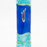Elegant glass mezuzah with Hebrew inscriptions, displayed on a clean white studio background with soft reflection, showcasing fine details.