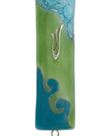 Elegant Ocean Glass Mezuzah made in USA, 4.5 inches tall, with Hebrew engraved details, set against a clean white background with soft reflection.