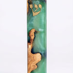 Olive wood Ocean Mezuzah with resin, 6 inches tall, detailed Hebrew inscriptions, natural textured surface, mounted on a white backdrop with soft reflection.