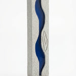 High-resolution image of the Oceanside Mezuzah with detailed engravings, Hebrew letters, and decorative motifs on a white studio background with a soft reflection.