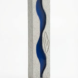 High-resolution image of the Oceanside Mezuzah with detailed engravings, Hebrew letters, and decorative motifs on a white studio background with a soft reflection.