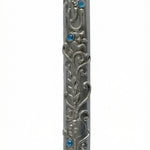 High-resolution image of an Ofir Mezuzah made of pewter, standing 7 inches tall, with intricate engraved Hebrew letters and decorative motifs, on a white studio background with soft reflection.