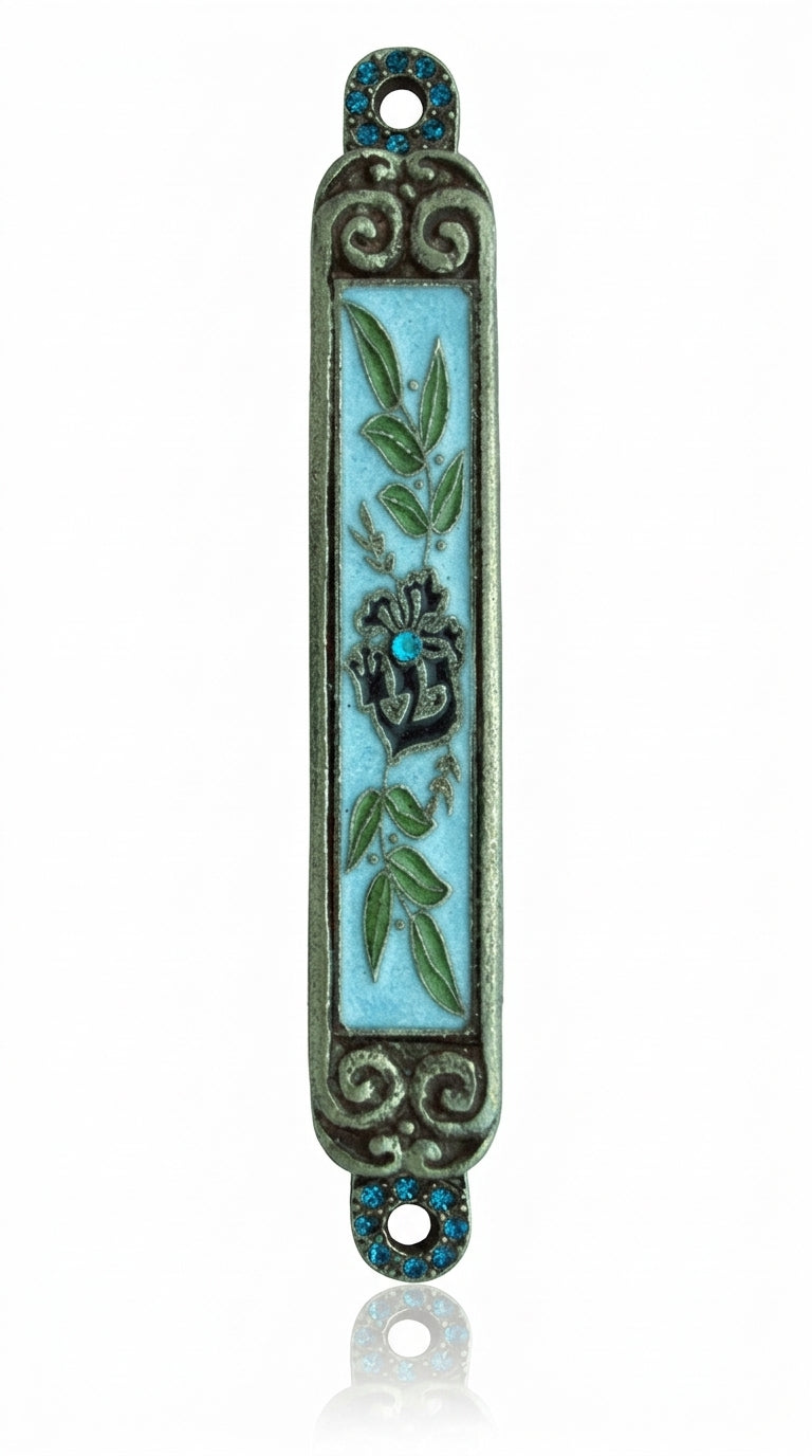 Hand-painted pewter Mezuzah with olive branches, crystal center, and intricate details on white background with soft reflection.