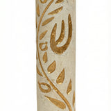 High-resolution image of a handcrafted Jerusalem stone Mezuzah with a golden olive branch design, on a bright white studio background with subtle reflection.