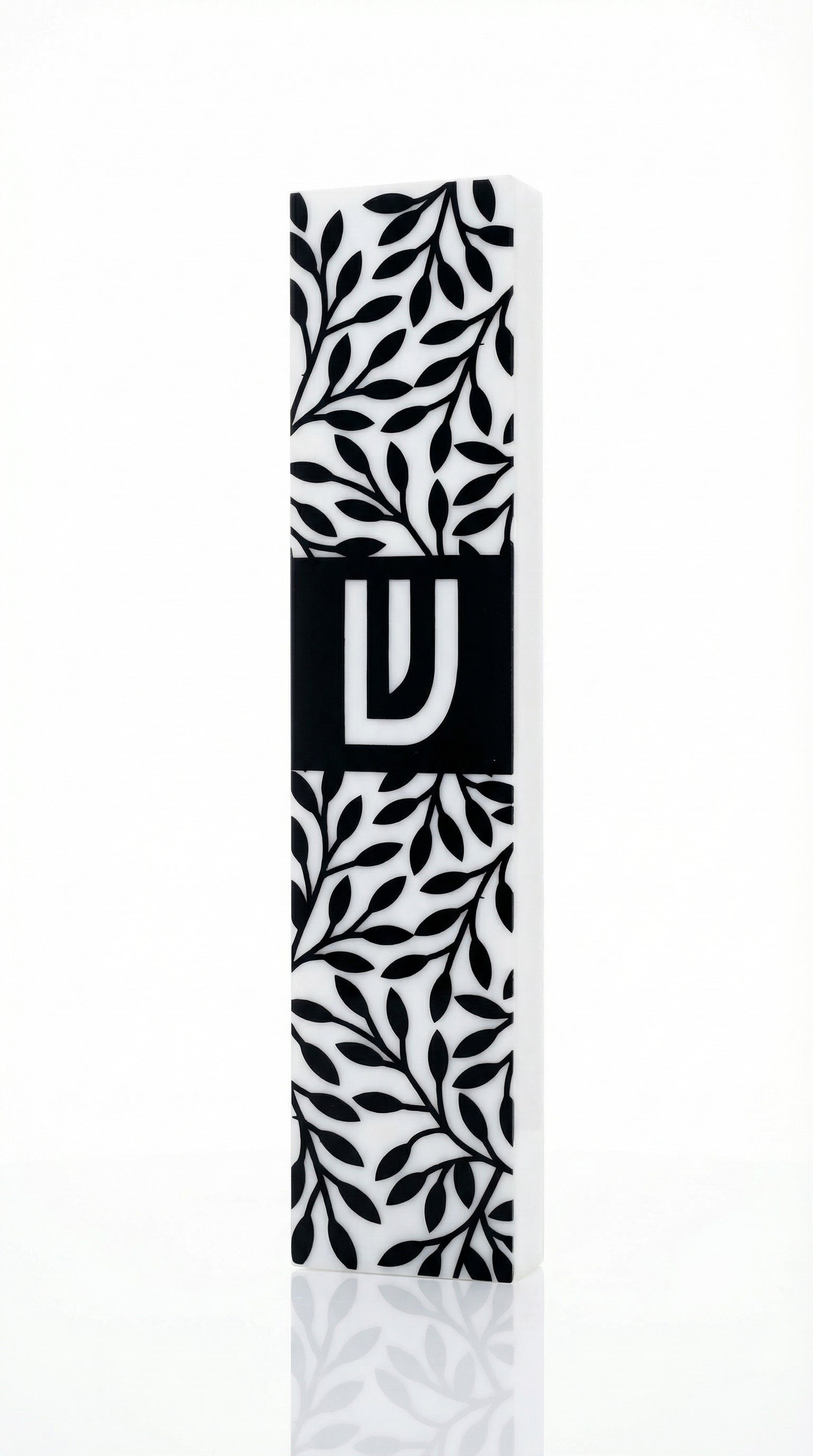 Upscale image of an olive branches mezuzah made of acrylic, with intricate details, Hebrew text, and decorative motifs, on a white studio background with soft reflection.