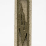 High-resolution image of an olive green Jerusalem stone mezuzah, showcasing fine surface details and texture on a white studio background with soft reflection.