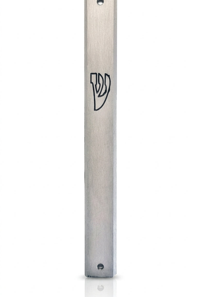 Elegant outdoor aluminum mezuzah with screw cap for weather resistance, designed to hold a 4-inch kosher scroll, mounted on door in home setting.