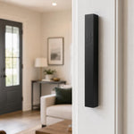 Black aluminum outdoor mezuzah mounted on a doorpost, weather-resistant with screw-cap closure, modern and sleek for contemporary entrances.