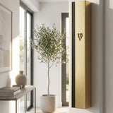 Metal outdoor mezuzah in gold and black aluminum mounted on a doorframe with weather-resistant features.