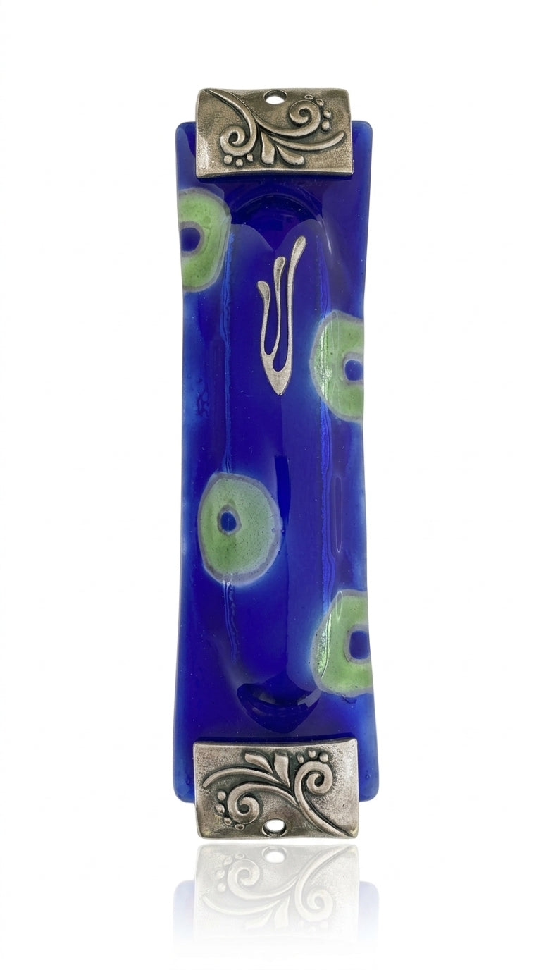 Fused-glass Peacock Mezuzah with blue and green circles, silver textured accents, and Hebrew inscriptions, displayed vertically against a pure white background with subtle reflection.