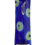 Fused-glass Peacock Mezuzah with blue and green circles, silver textured accents, and Hebrew inscriptions, displayed vertically against a pure white background with subtle reflection.