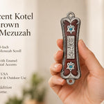 Hand holding a Pearlescent Kotel Heart brown pewter mezuzah with enamel finish, raised Shin and blue heart-shaped Star of David accents